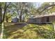 Large backyard with trampoline, shed, and mature trees at 10135 Se 108Th Terrace Rd, Ocala, FL 34472