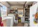 Bright laundry room with washer, dryer, and extra storage at 10135 Se 108Th Terrace Rd, Ocala, FL 34472