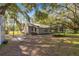 Large backyard with trampoline and mature trees at 10135 Se 108Th Terrace Rd, Ocala, FL 34472
