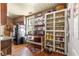 Kitchen features wood cabinets, granite countertops, and ample shelving at 10135 Se 108Th Terrace Rd, Ocala, FL 34472