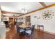 View of the dining area with hardwood floors and a round table at 10135 Se 108Th Terrace Rd, Ocala, FL 34472