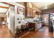 Kitchen with wood cabinets, granite counters, and copper mugs at 10135 Se 108Th Terrace Rd, Ocala, FL 34472