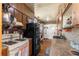 Cozy kitchen features wood cabinets, gas stove, and refrigerator at 10135 Se 108Th Terrace Rd, Ocala, FL 34472
