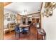 Bright dining room with hardwood floors and round table at 10135 Se 108Th Terrace Rd, Ocala, FL 34472
