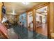 Long hallway with wood floors and views into other rooms at 10135 Se 108Th Terrace Rd, Ocala, FL 34472