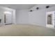 Spacious living room with neutral carpet and access to a hallway at 13552 Sw 81St Cir, Ocala, FL 34473
