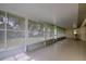 Bright screened porch with tiled flooring and plenty of windows at 13552 Sw 81St Cir, Ocala, FL 34473