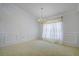 Bright dining room features a chandelier and window coverings at 13552 Sw 81St Cir, Ocala, FL 34473