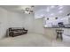 Bright living room features an open floor plan, kitchen island, and neutral colors at 13552 Sw 81St Cir, Ocala, FL 34473