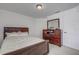Bedroom with a dark wood dresser and mirror at 13552 Sw 81St Cir, Ocala, FL 34473