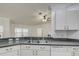 Kitchen features double sink and dishwasher at 13552 Sw 81St Cir, Ocala, FL 34473