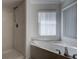 Bathroom with a large tub and shower, perfect for relaxation at 13552 Sw 81St Cir, Ocala, FL 34473