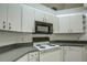 View of kitchen appliances and cabinetry at 13552 Sw 81St Cir, Ocala, FL 34473