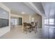 Small table and chairs in a bright screened porch at 13552 Sw 81St Cir, Ocala, FL 34473