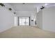 Spacious living room with view to backyard through sliding glass doors at 13552 Sw 81St Cir, Ocala, FL 34473
