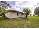 Rear view of a single-story house with a large backyard at 13552 Sw 81St Cir, Ocala, FL 34473