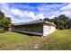 Screened porch and backyard view of single-story home at 13552 Sw 81St Cir, Ocala, FL 34473