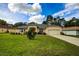 Single-story home with a two-car garage and lush lawn at 13552 Sw 81St Cir, Ocala, FL 34473
