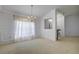 Dining room with decorative wall paneling and view to hallway at 13552 Sw 81St Cir, Ocala, FL 34473