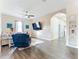 Spacious living area with a sectional sofa and large TV at 227 Locust Pass Crse, Ocala, FL 34472