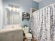 Updated bathroom with modern vanity and shower at 227 Locust Pass Crse, Ocala, FL 34472