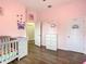 bedroom with a crib and themed decor at 227 Locust Pass Crse, Ocala, FL 34472