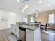 Well-equipped kitchen featuring granite countertops and modern fixtures at 227 Locust Pass Crse, Ocala, FL 34472