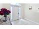 Bright and airy foyer with a white front door at 227 Locust Pass Crse, Ocala, FL 34472