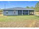 House exterior and spacious backyard view at 227 Locust Pass Crse, Ocala, FL 34472