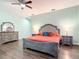Main bedroom with a king-size bed and en-suite bathroom at 227 Locust Pass Crse, Ocala, FL 34472