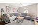 Cozy living room featuring a large sectional sofa and a wood coffee table at 4535 Se 32Nd Pl, Ocala, FL 34480