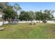 Large backyard with playset, trampoline, and fire pit at 4535 Se 32Nd Pl, Ocala, FL 34480
