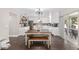 Modern kitchen with white cabinets, granite countertops, and an island at 4535 Se 32Nd Pl, Ocala, FL 34480