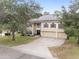 Two-story house with solar panels and landscaped yard at 4535 Se 32Nd Pl, Ocala, FL 34480