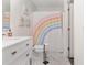 Bathroom featuring a rainbow shower curtain and white vanity at 4535 Se 32Nd Pl, Ocala, FL 34480