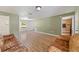 Spacious living room with hardwood floors and a neutral color scheme at 1811 Ne 30Th St, Ocala, FL 34479