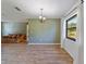Spacious dining area with wood floors and a chandelier at 1811 Ne 30Th St, Ocala, FL 34479