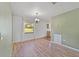 Bright dining area with hardwood floors and a chandelier at 1811 Ne 30Th St, Ocala, FL 34479