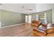 Spacious living room with hardwood floors and a neutral color scheme at 1811 Ne 30Th St, Ocala, FL 34479