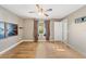 Bedroom with wood floors, ceiling fan, and mountain mural at 1811 Ne 30Th St, Ocala, FL 34479