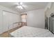 Bright bedroom with double bed, closet and mountain mural at 1811 Ne 30Th St, Ocala, FL 34479