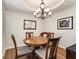 Charming dining room with a wood table and chandelier at 16895 Se 110Th Court Rd, Summerfield, FL 34491