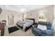 Bright bedroom with a comfy seating area and ensuite bathroom access at 4736 Se 34Th St, Ocala, FL 34480