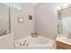 Relaxing bathroom featuring a corner soaking tub at 4736 Se 34Th St, Ocala, FL 34480