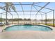 Kidney shaped pool with screened enclosure at 4736 Se 34Th St, Ocala, FL 34480