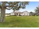 One-story home with a large yard and mature tree at 4736 Se 34Th St, Ocala, FL 34480