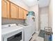 Bright laundry room with cabinets and shelving, offering convenient storage space at 4736 Se 34Th St, Ocala, FL 34480