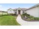 One-story home with landscaped yard and walkway to entry at 4736 Se 34Th St, Ocala, FL 34480