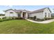 One-story home with a landscaped lawn and walkway at 4736 Se 34Th St, Ocala, FL 34480