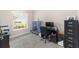Home office with built-in shelving and a view of the living room at 4736 Se 34Th St, Ocala, FL 34480